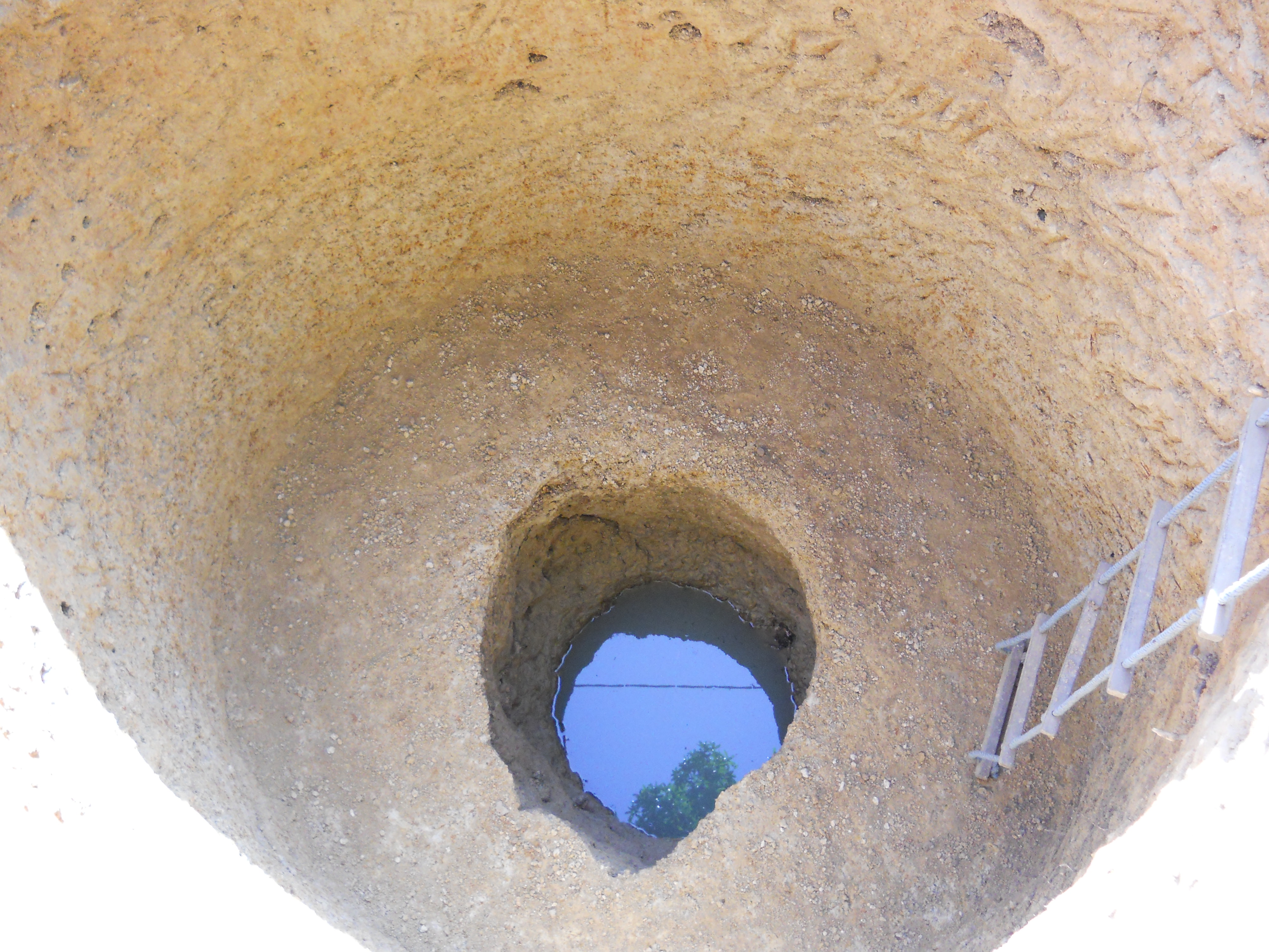 Dug out section of the eroded well